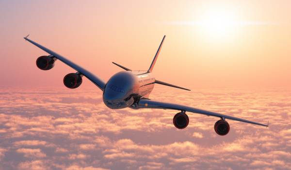 Cargo aircraft flying at sunrise, representing Nexline’s efficient air transport in its multimodal service