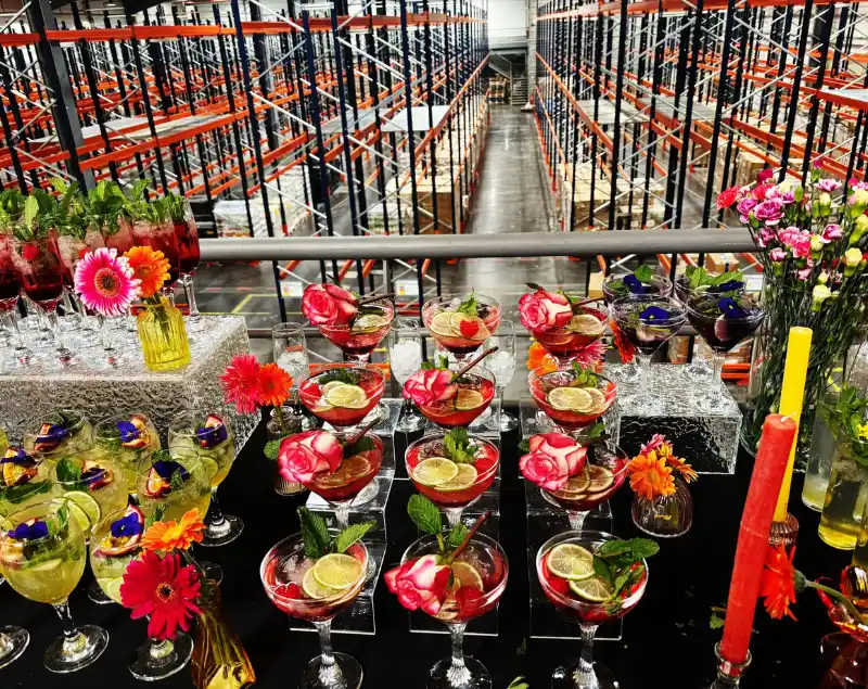 Corporate event with cocktails set in a logistics warehouse environment